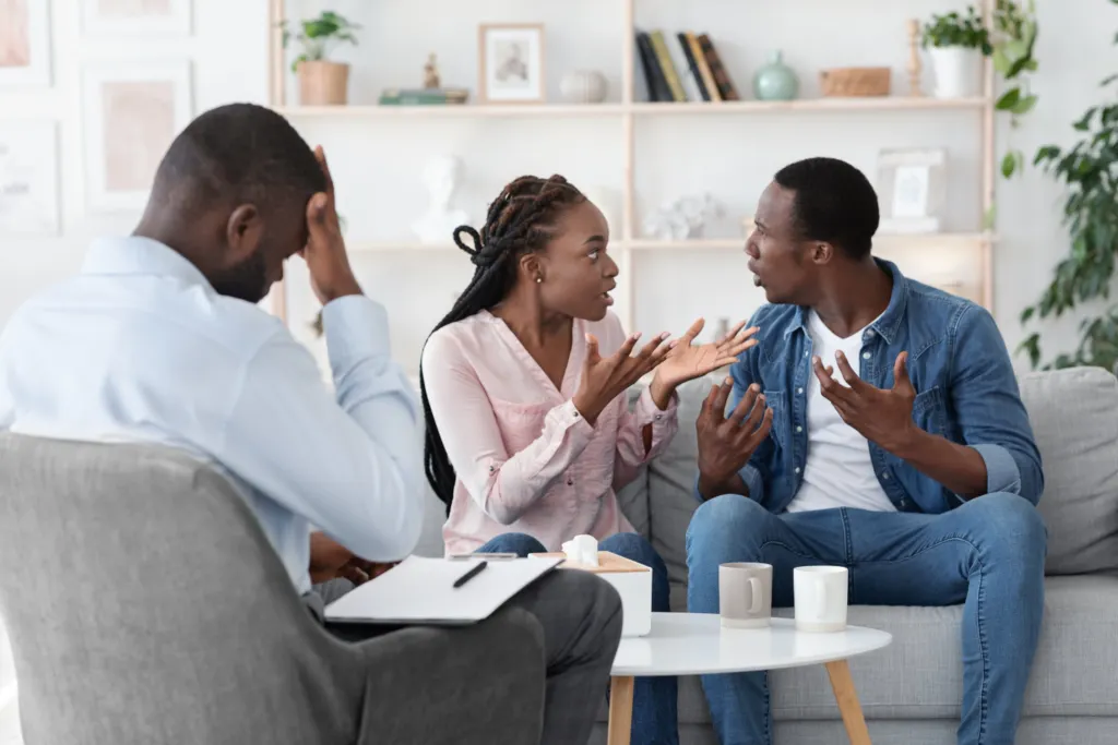 An illustration depicting a diverse couple fighting with each other, engaging in open conversation, symbolizing unhealthy communication and relationships within family dynamics.