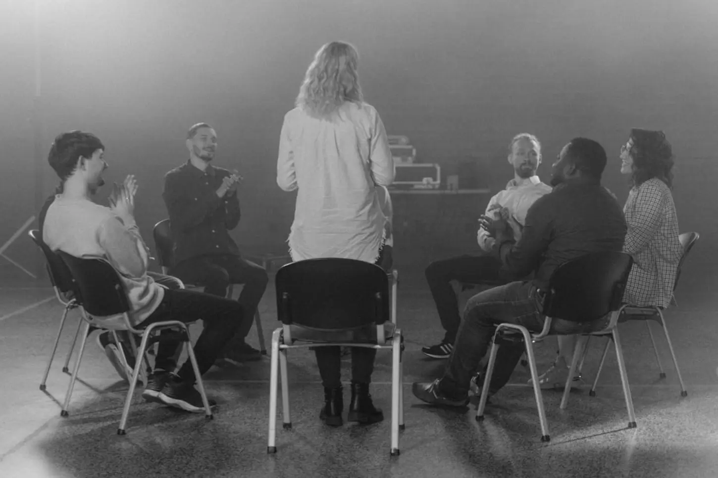 Discover effective icebreakers in group therapy that foster connection, trust, and communication. Easy to implement and perfect for any group! Clients engaging in an icebreaking session during group therapy, fostering connection and communication.
